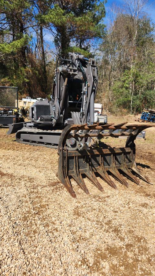 Excavator with root rake