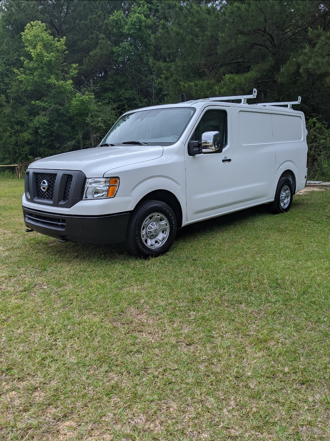 Nissan NV cargo van with ladder rack — Dirty Works fleet