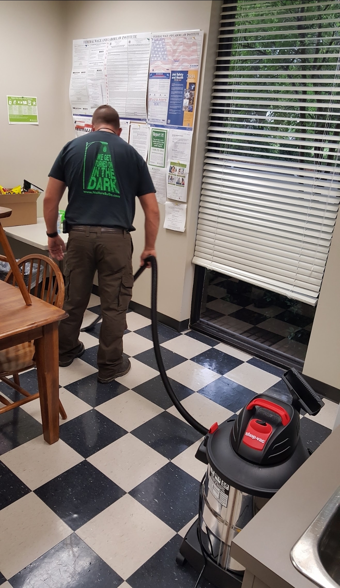 Tech cleaning up after kitchen equipment service