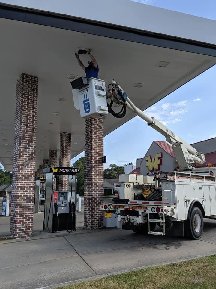 Fastway Fuels canopy — bucket truck on site